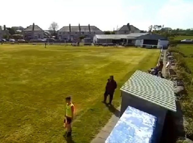 Footage shows the linesman and the Amlwch manger crossing on the touchline in the first half