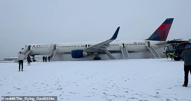 Footage shared by others at the airport showed passengers exiting the Delta plane on inflatable slides on a snow-covered runway as emergency services rushed to the scene