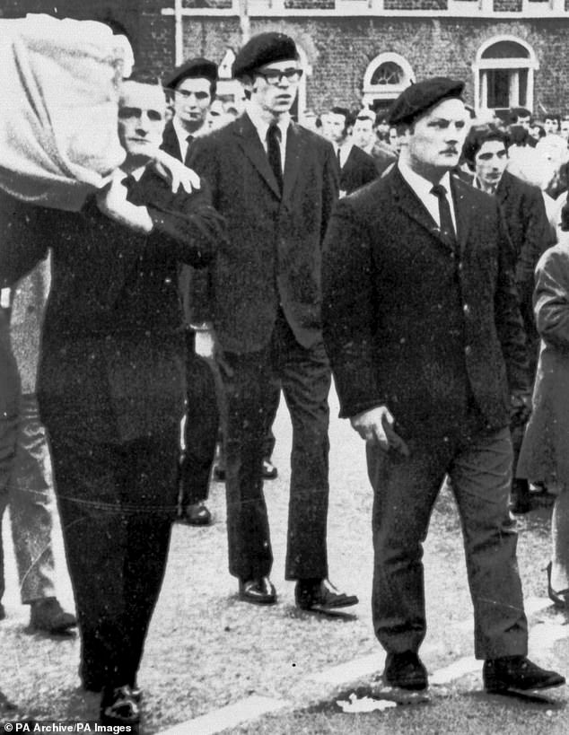 A photograph of Gerry Adams (centre) in Belfast in 1973, acting as a member of the IRA guard of honor at the funeral of a member killed during the planting of a bomb