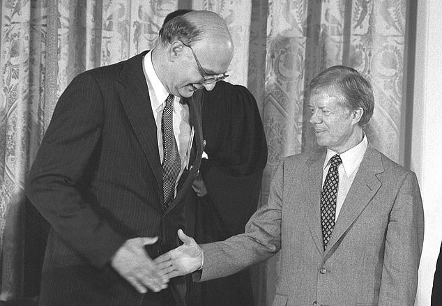 Lasting legacy: Carter (right) with Paul Volcker (left), who was parachuted in as chairman of the Federal Reserve