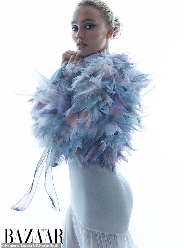 Lily-Rose modeled a range of looks, including a blue and purple feathered number