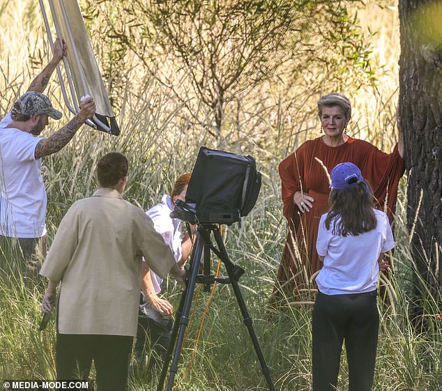 Ms Bishop appeared in her element as she stepped out in a floor-length Zimmermann dress and posed next to a tree