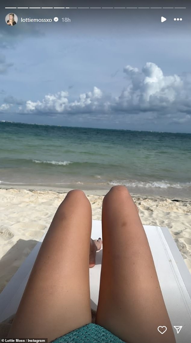 Lottie also shared a photo of herself sunbathing on the beach