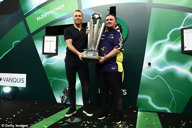 Littler received the trophy from Sir Chris Hoy (left), ambassador for Prostate Cancer UK