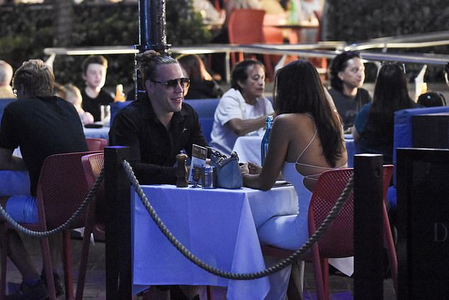 The couple were then seen enjoying an intimate dinner at an open-air restaurant, before watching a fireworks show nearby