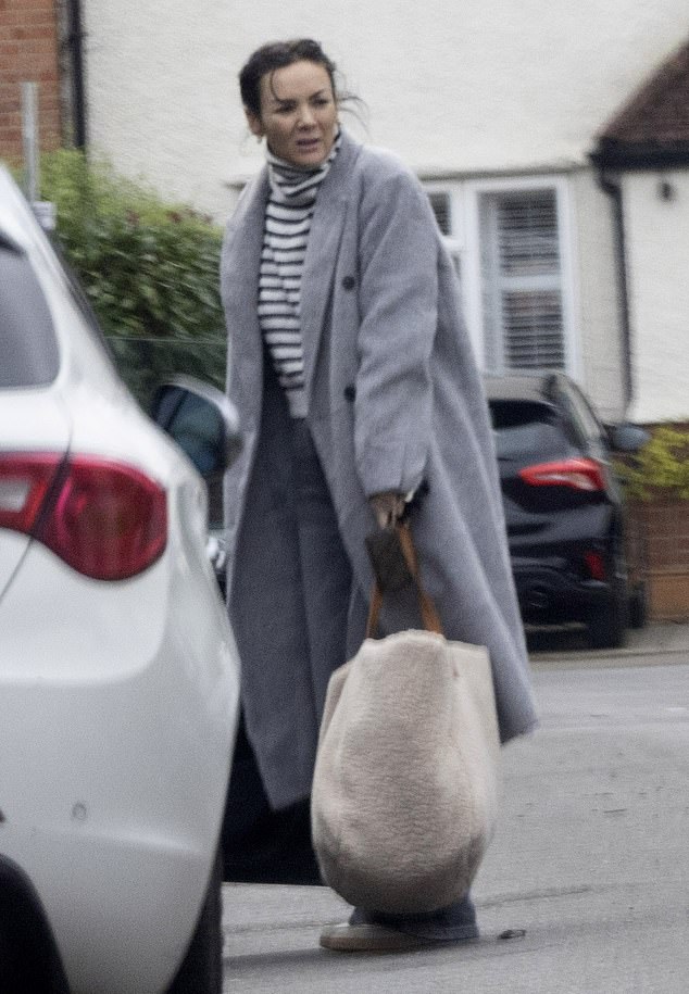 Martine was spotted carrying a fluffy tote bag into her home on Tuesday as she prepared for New Year's Eve