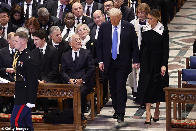 The incoming first lady wore a black dress with an oversized, dramatic white collar with an abstract black and white design