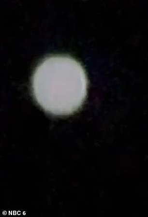 The eerie images showed a circular haze of white light turning into a green color, with a circular halo surrounding the object