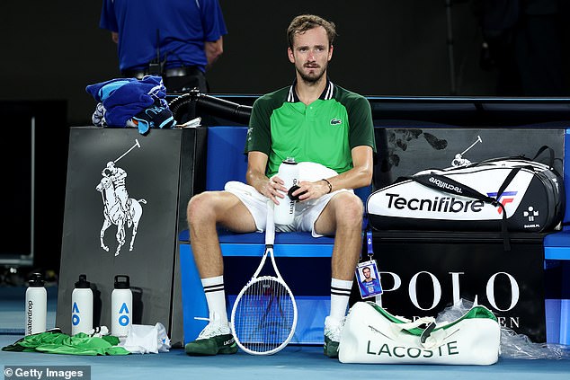 Medvedev is pictured after his crushing defeat to Jannik Sinner in the men's singles final in Melbourne last year - the second time he has lost the crown despite winning the first two sets