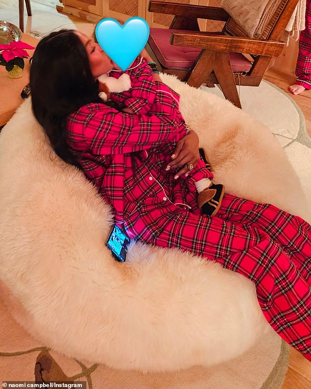 In the snap, Naomi and her son can be seen wearing matching red tartan pajamas