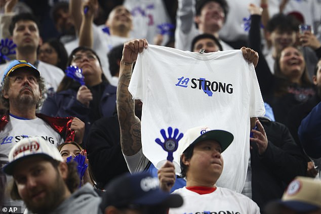 A Los Angeles Clippers fan holds up an 