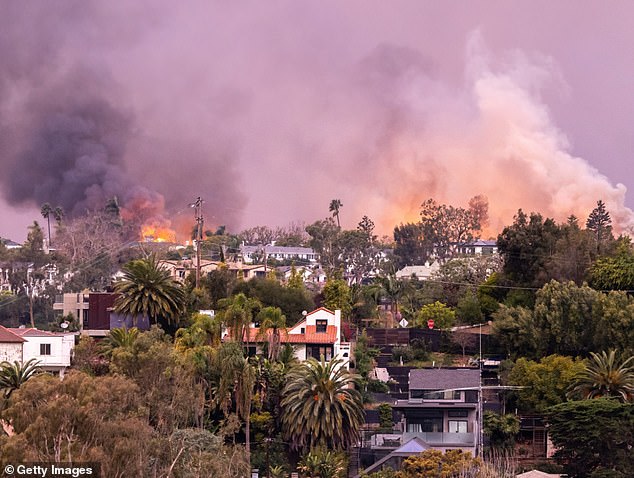 The fire in the upscale LA neighborhood — which started Tuesday morning — has currently burned about 1,000 buildings and 15,832 acres, per KTLA 5