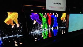 Panasonic Z95B OLED TV with an image of dancing people in colorful clothes