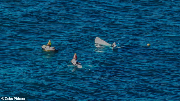 Only the tail fin and rudder of the plane stick out of the water (photo)