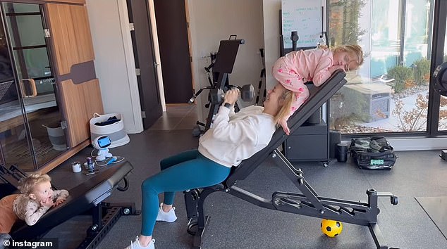 While they were simultaneously trying to watch their children in their home gym, it appeared that their three-year-old daughter Sterling had climbed to the top of a bench and at one point sat on Brittany's head.