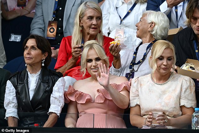 Rebel looked like she had just stepped off a red carpet in the ruffled costume that showed off a hint of cleavage as she sat among a sea of ​​casually dressed onlookers. Rebel sat next to Tennis Australia boss Jayne Hrdlika (left)