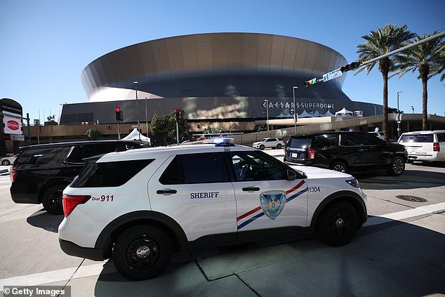 Police vehicles are seen outside the Louisiana Superdome after Wednesday's attack