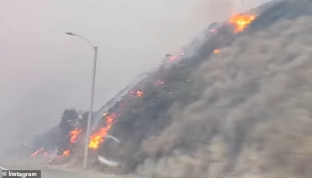 The hill was on fire as she drove down the famous road