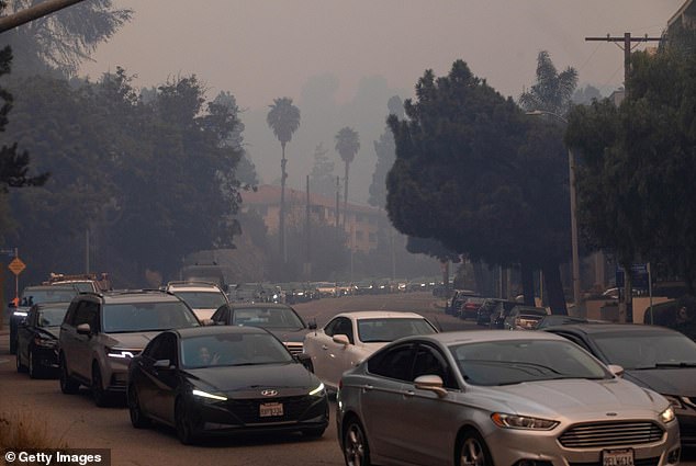 He was stuck among a crowd of motorists trying to flee the fire. Many drivers panicked and fled their vehicles, forcing firefighters to use bulldozers to clear the way for emergency vehicles