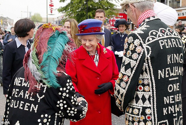 Studies have shown that even Queen Elizabeth II was not immune to the influence of the Cockney accent, as her speeches gradually came closer to this dialect between 1950 and 1980. Pictured: Queen Elizabeth II meeting the 'Pearly King and Queen' of Newham in 2002