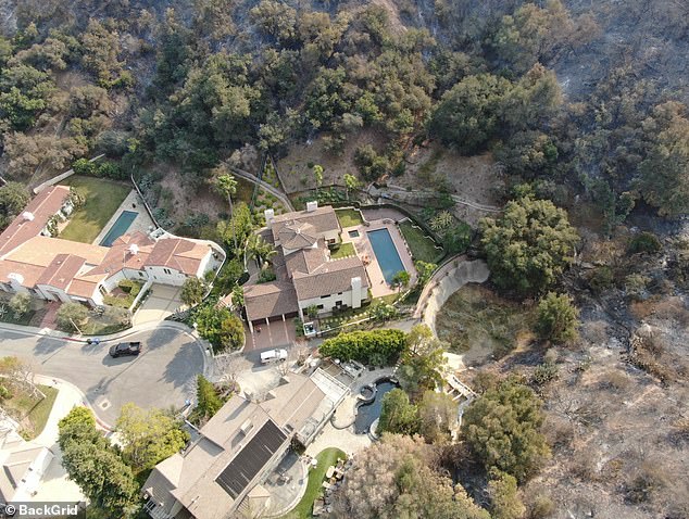 Guttenberg's home is still standing despite the scorched wreckage surrounding it, as evidenced by a photo obtained by DailyMail.com on Saturday.