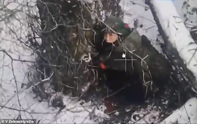 A North Korean soldier is seen hiding from a Ukrainian drone