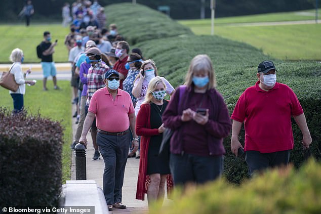 The rise of HMPV has drawn comparisons to the early days of the Covid pandemic. Pictured here is a group of voters casting early ballots during the 2020 election