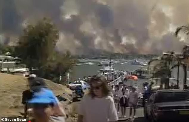 Thousands of residents were evacuated by road and waterways and the fires were fanned by high winds