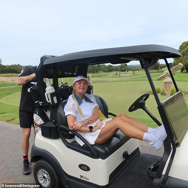 Other images showed her driving a golf cart in a semi-sheer white shirt and miniskirt