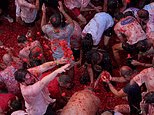Paint the city red! Thousands take over the Spanish village for the La Tomatina food fight