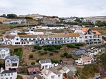 Don't turn our village into another Chelsea-on-Sea! Devon's neighbors declare war on Dubai-linked outsiders over their plan to turn a historic family hotel into a luxury waterfront venue