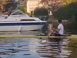 Moment furious speedboat driver 'tries to ram Olympic rower' on Thames and threatens him in river rage
