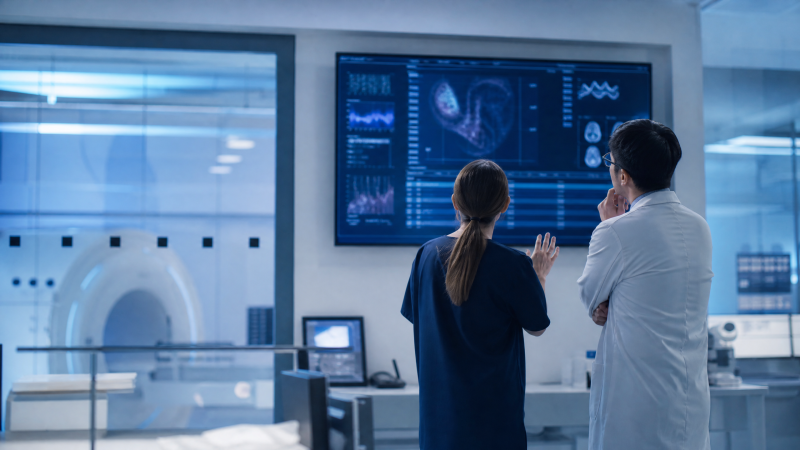 Editorial illustration of clinicians reviewing abstract digital health information