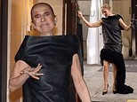 Celine Dion looks giddy as she returns to her hotel ahead of her Paris residency after dancing in the streets