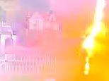 Moment New Yorker is struck by lightning while holding an umbrella during a thunderstorm... but is able to stagger to get help