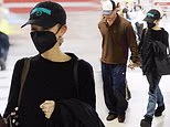 Ariana Grande and boyfriend Ricky Alvarez hold hands as they land back in New York after saying a tearful farewell to fans as she wrapped up her sold-out UK tour before the break