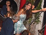 Amal Clooney needs help leaving her boat as she swaps red carpet dresses for a glittering fringe mini dress during a night out with husband George in Venice