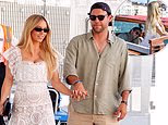 Sydney Sweeney wears a beautiful white lace dress as she holds hands with boyfriend Scooter Braun in Venice as he gets a cheeky crush on the water taxi