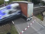 Truck is destroyed by speeding passenger train after driver stalls truck at Polish level crossing