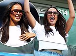 Maya Jama throws her hands in the air in delight and flashes a glimpse of her midriff as she cheers on the teams during the Women's Super League football match