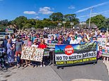 Hundreds of villagers are protesting against Eton College's 'shameful' plans to build a new town with 3,250 houses that could 'wipe out' the old hamlet