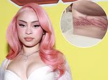Ice Spice is plagued by 'dirty' thigh tattoos as she introduces 'unreadable' new inks