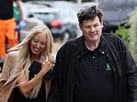 The Chase star Mark Labbett and girlfriend Hayley Palmer hold hands as they leave a London hotel as they are spotted for the first time since it was confirmed they are back together