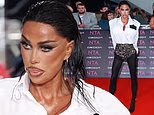 Katie Price wows with a terrifying, heavy make-up look as she turns heads on the NTA red carpet - covering her black eye after getting facial filler and new breast implants just hours earlier