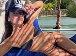 Dua Lipa shows off her incredible figure in a strapless bikini as she effortlessly performs a headstand on a paddleboard in fun photos from the girls' weekend