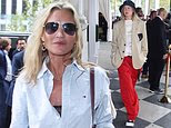 Kate Moss keeps it casual in a signature Tommy Hilfiger shirt as she joins Gigi Hadid and Romeo Beckham at New York Fashion Week